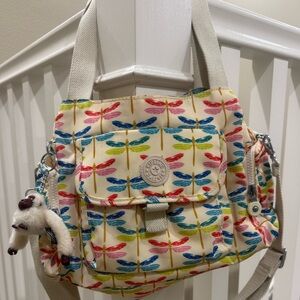 Kipling bag with unique dragonfly print. Lots of pockets, very roomy!